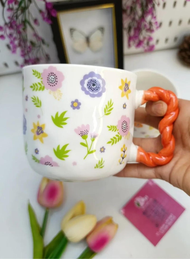 مج بورسيلين راقي سعة 380 ملي بنقوش أزهار ربيعية زاهية ويد حمراء ملتوية بتصميم عصري مريح - Image 4
